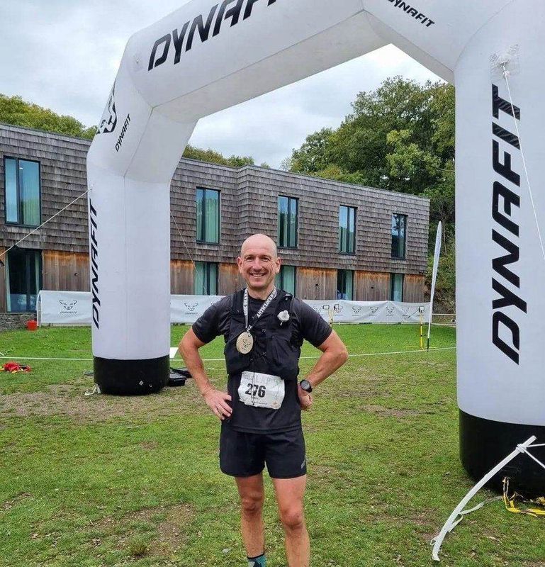 Mark finishing The Lap with his medal, 6th overall