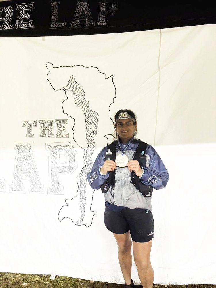 Yasmin with her medal at The Lap finish